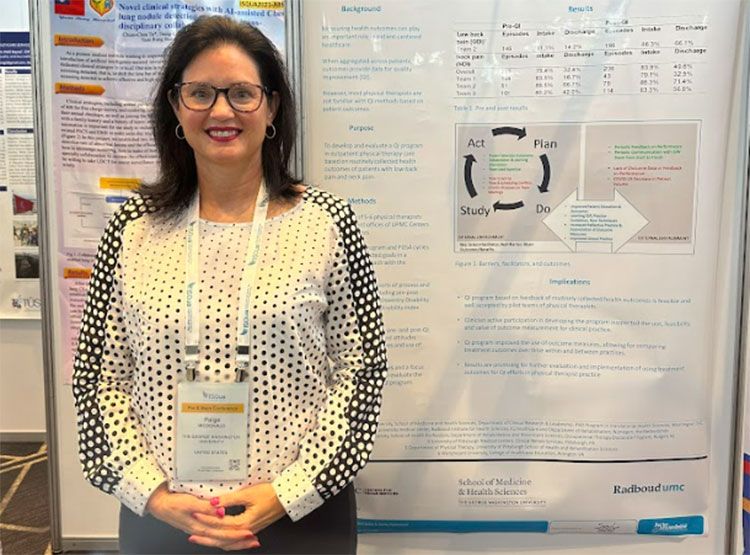 Paige McDonald standing with a presentation poster