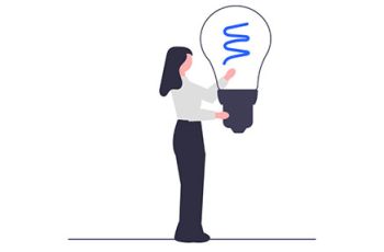 Woman holding a large lightbulb